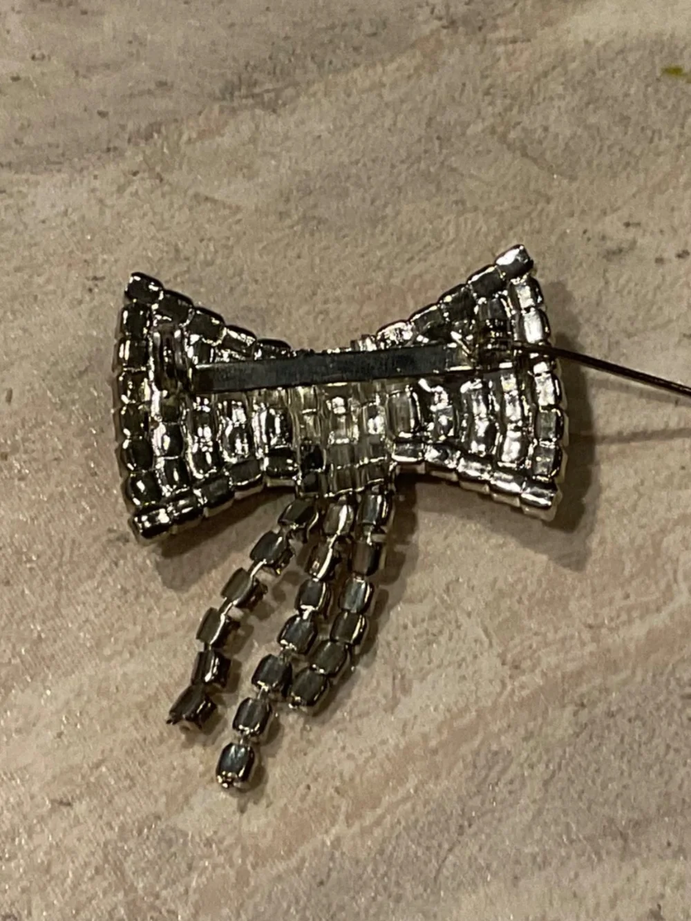 Vintage Rhinestone Bow Brooch Silvertone setting 1.5”